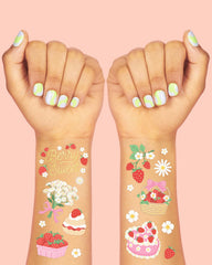 xo-fetti strawberry tattoos foil-flowers add colorful garden vibes for guests.