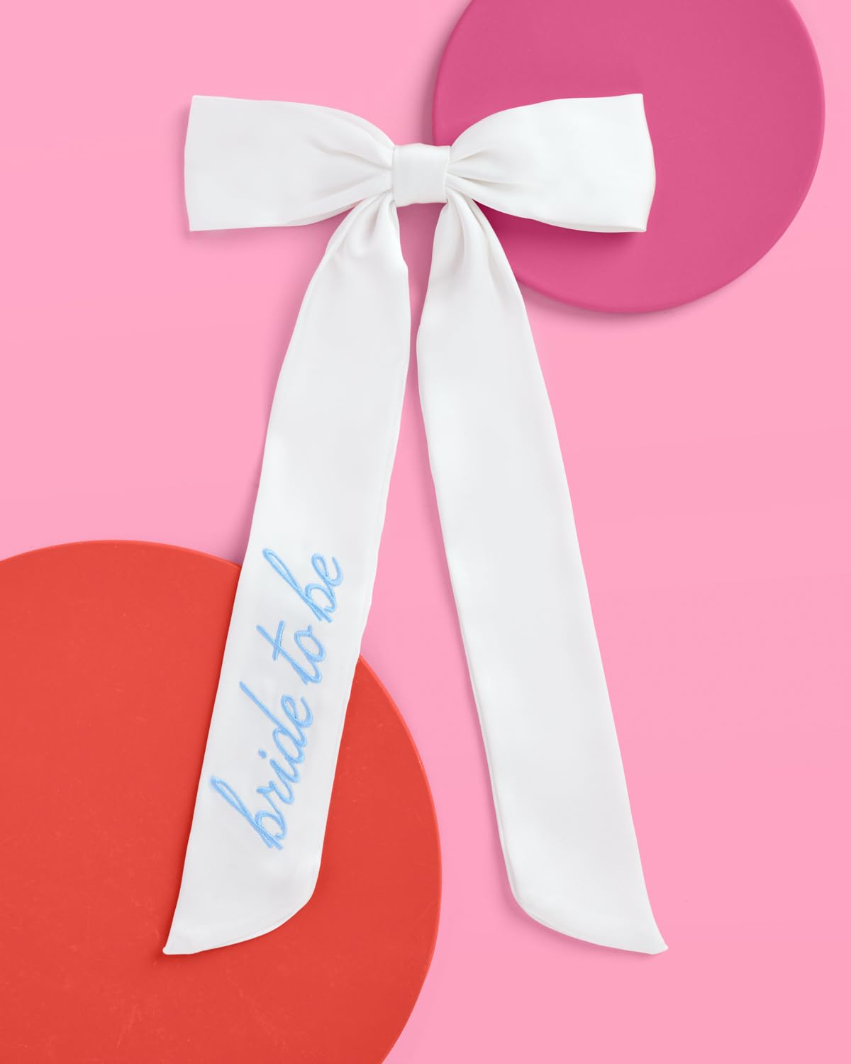 xo, fetti white satin hair bow close-up embroidery detail ideal for engagement shoots