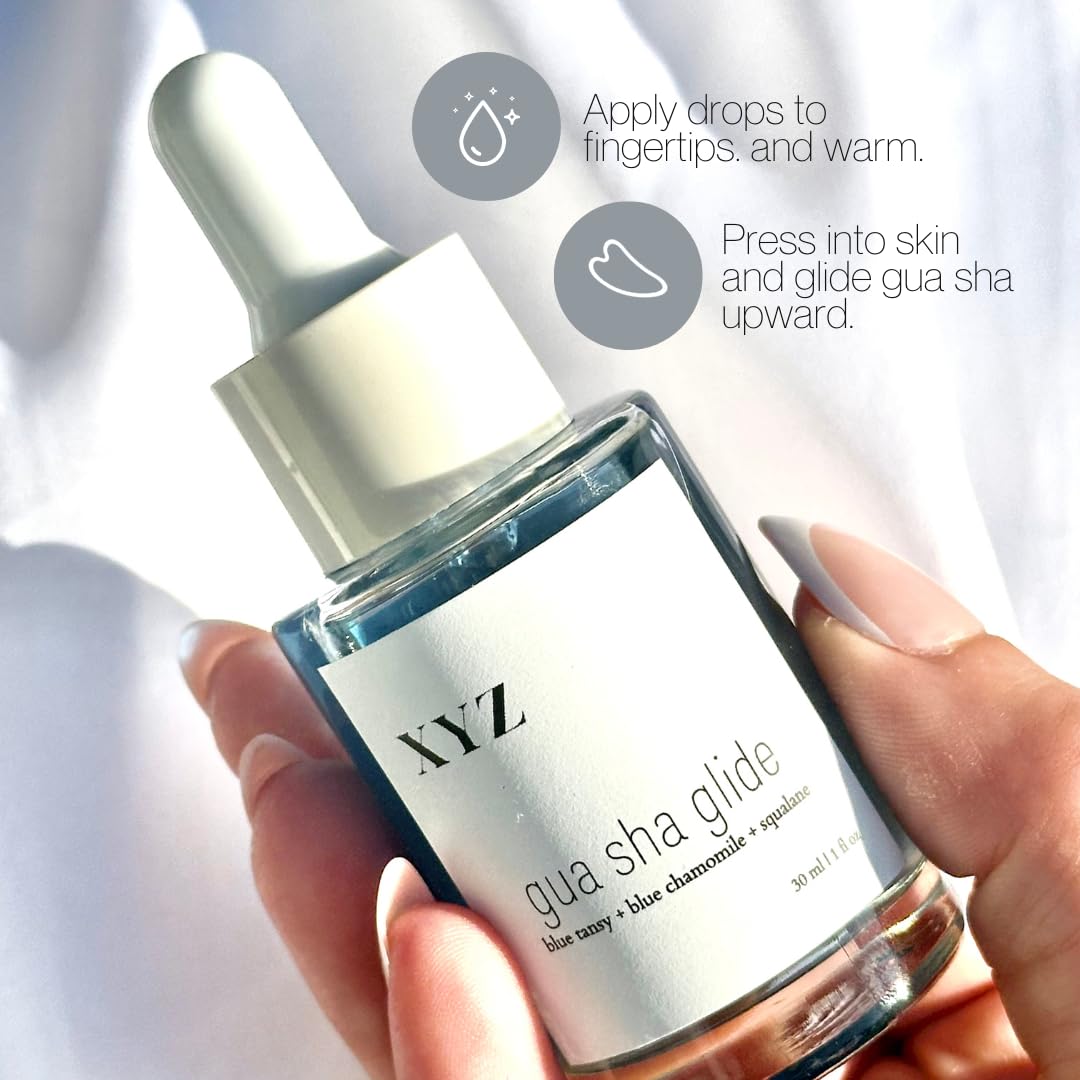 XYZ Skin Gua Sha Glide on hand demonstrates slipping action for massage.