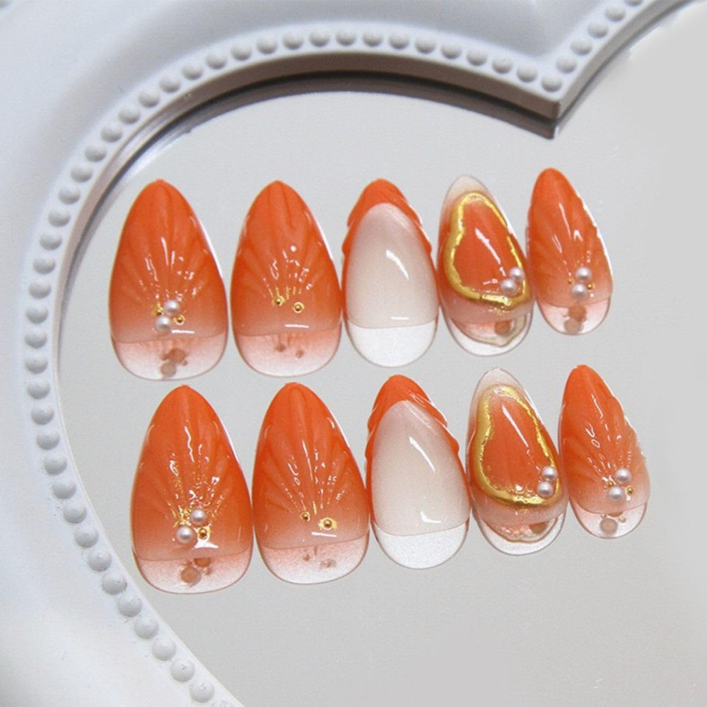 Yabonica orange almond nails on a hand show comfortable short shape.