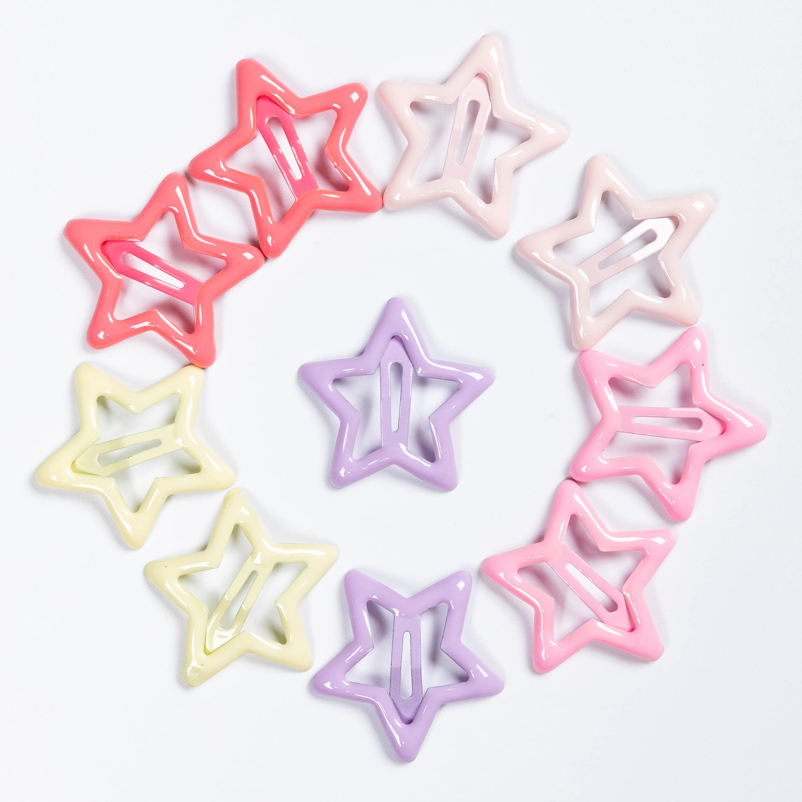 Yaokua star clips laid out with outfits for color-coordinated styling.