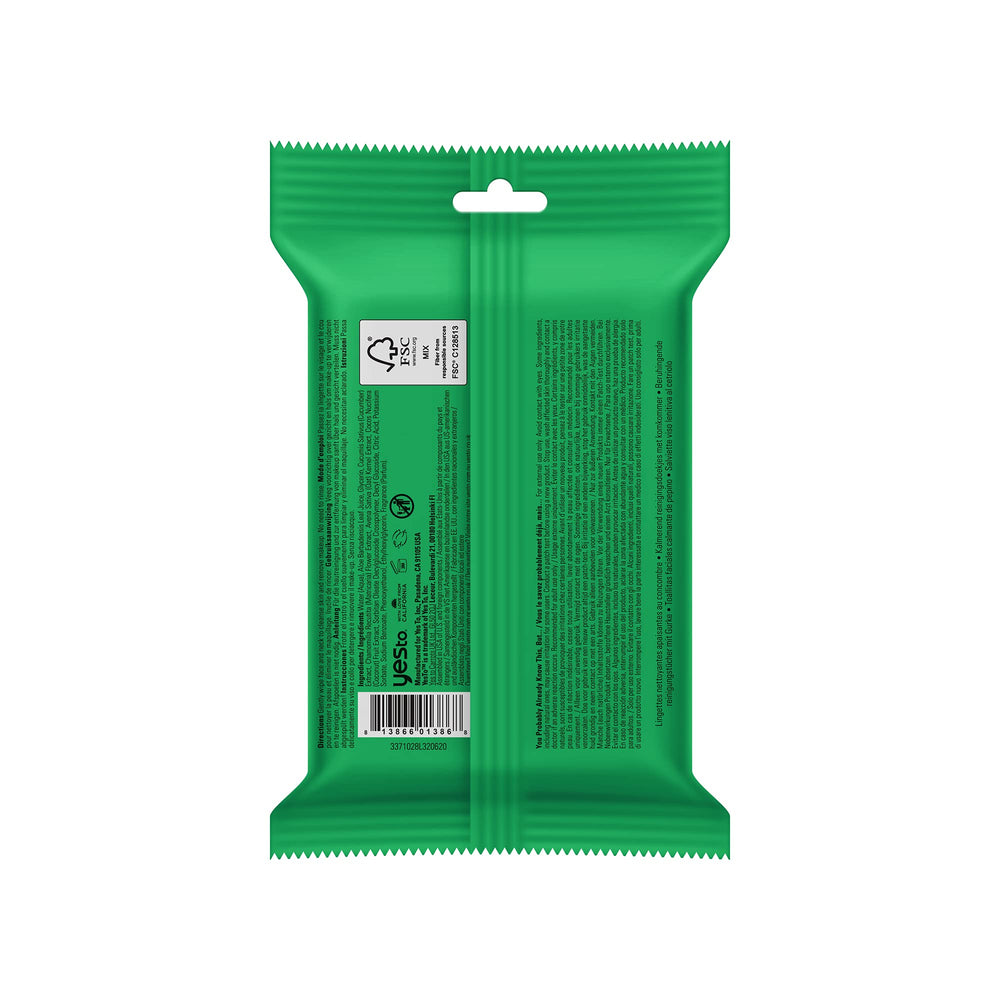 Yes To Cucumbers travel facial cleanser wipes in hand for purse-size skincare.