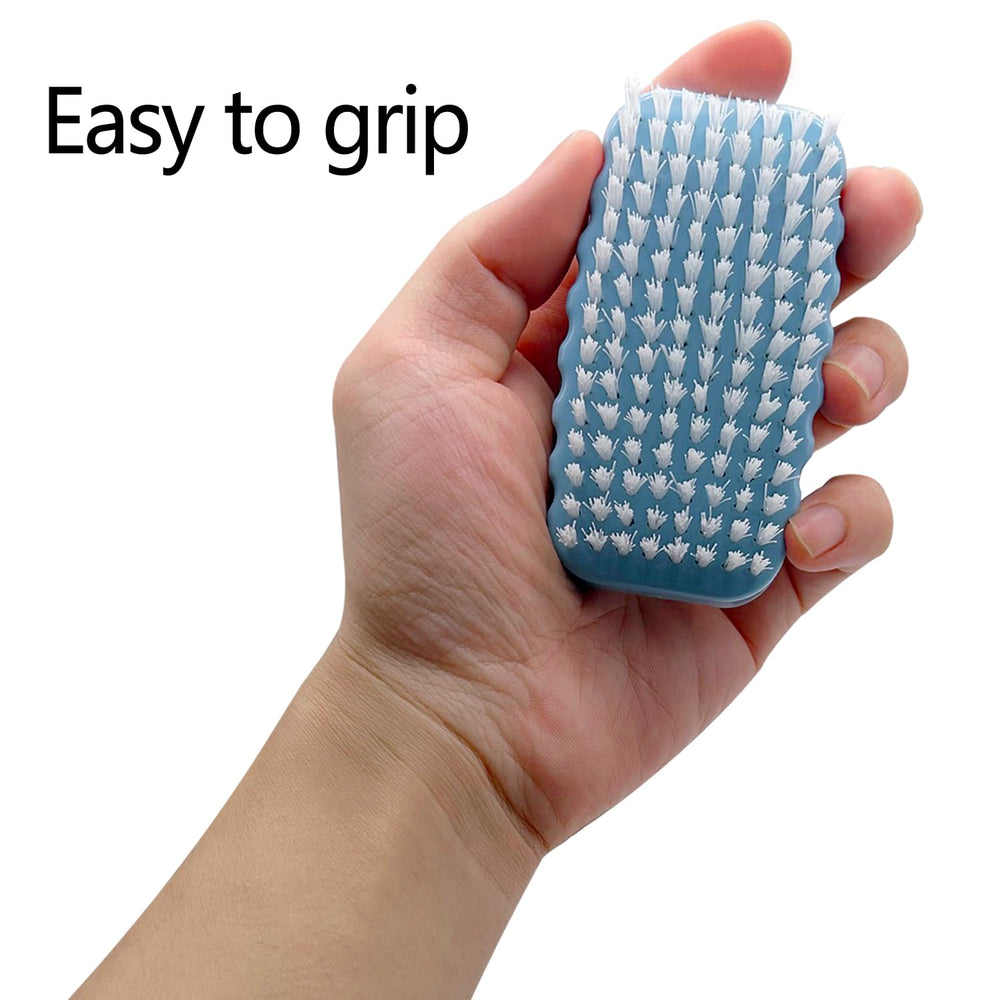 Ylijxqc nail brush in action on hands after gardening for clean fingernails.