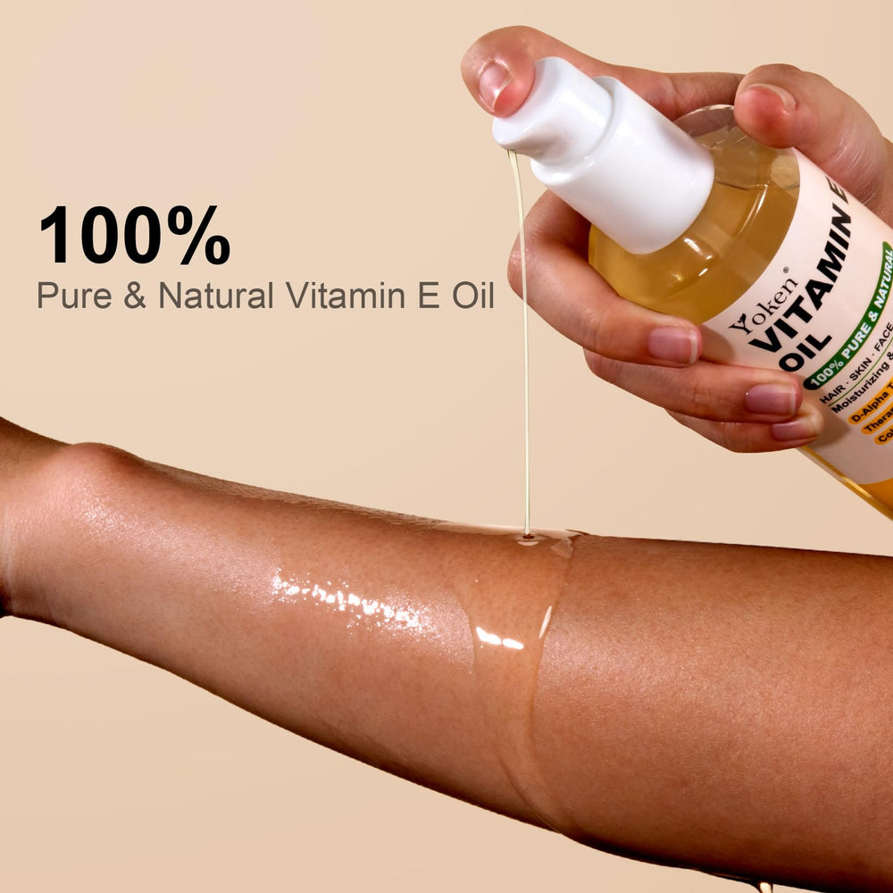 Yoken Vitamin E oil being massaged into skin for hydration and softness.