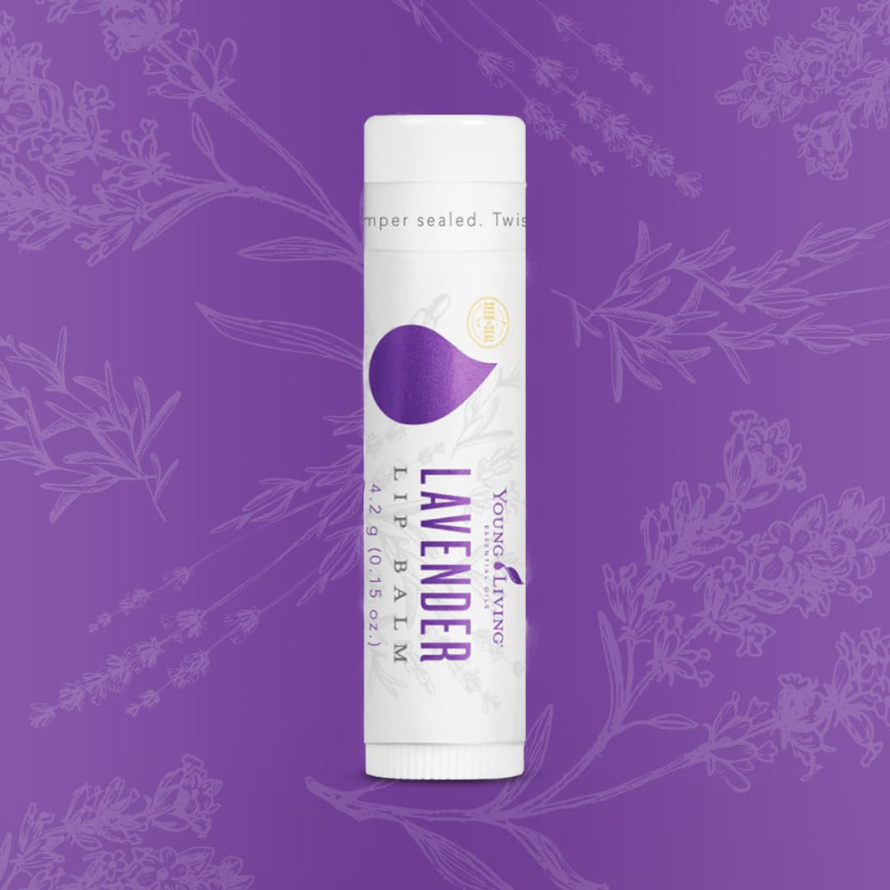 Young Living Lavender Lip Balm tube closeup highlights smooth easy application and calming lavender aroma.