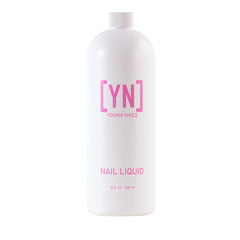 Young Nails liquid monomer bottle pouring for smooth acrylic application at home.