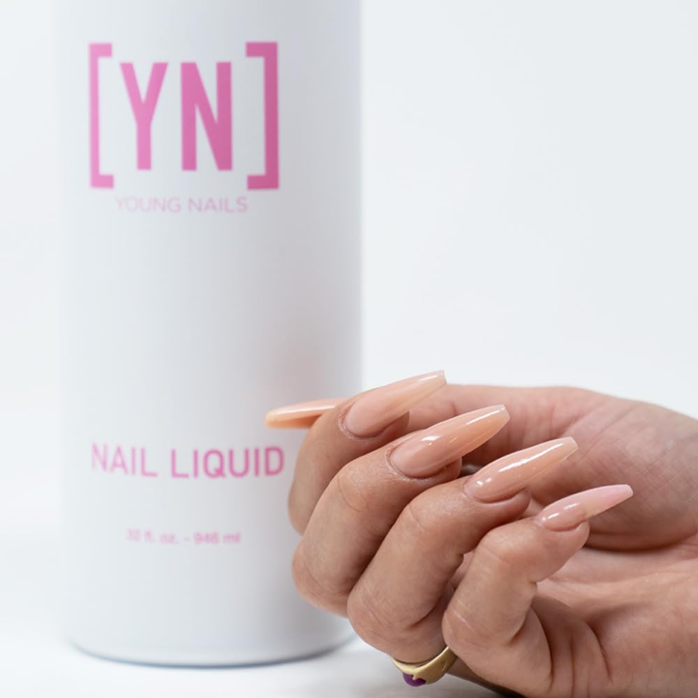 Young Nails liquid monomer bottle emphasizes low-odor formula for comfortable use.