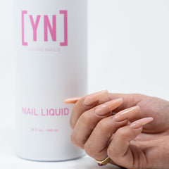 Young Nails liquid monomer bottle emphasizes low-odor formula for comfortable use.