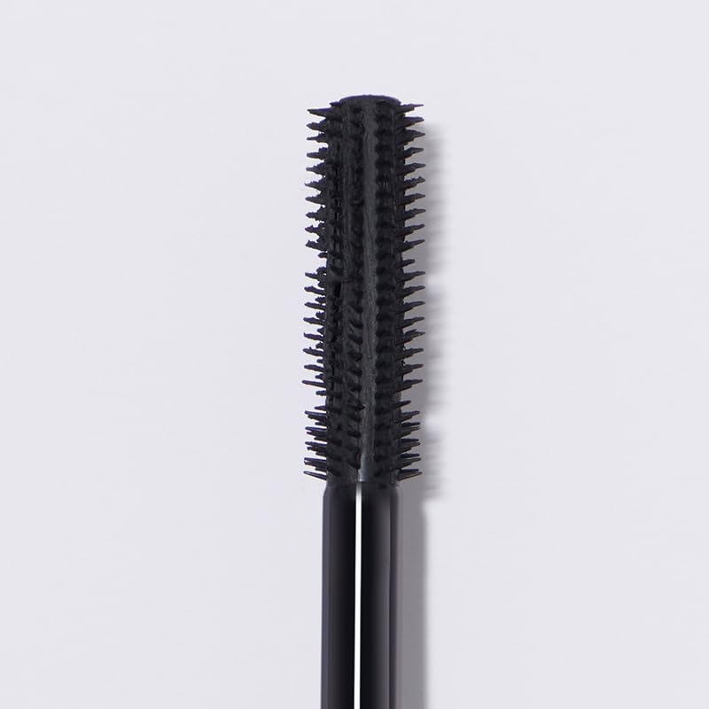 Close-up of the dual-wand applicator delivering defined lashes