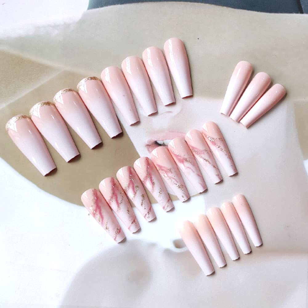 YoYoee nude press-on nails closeup with glossy marble design