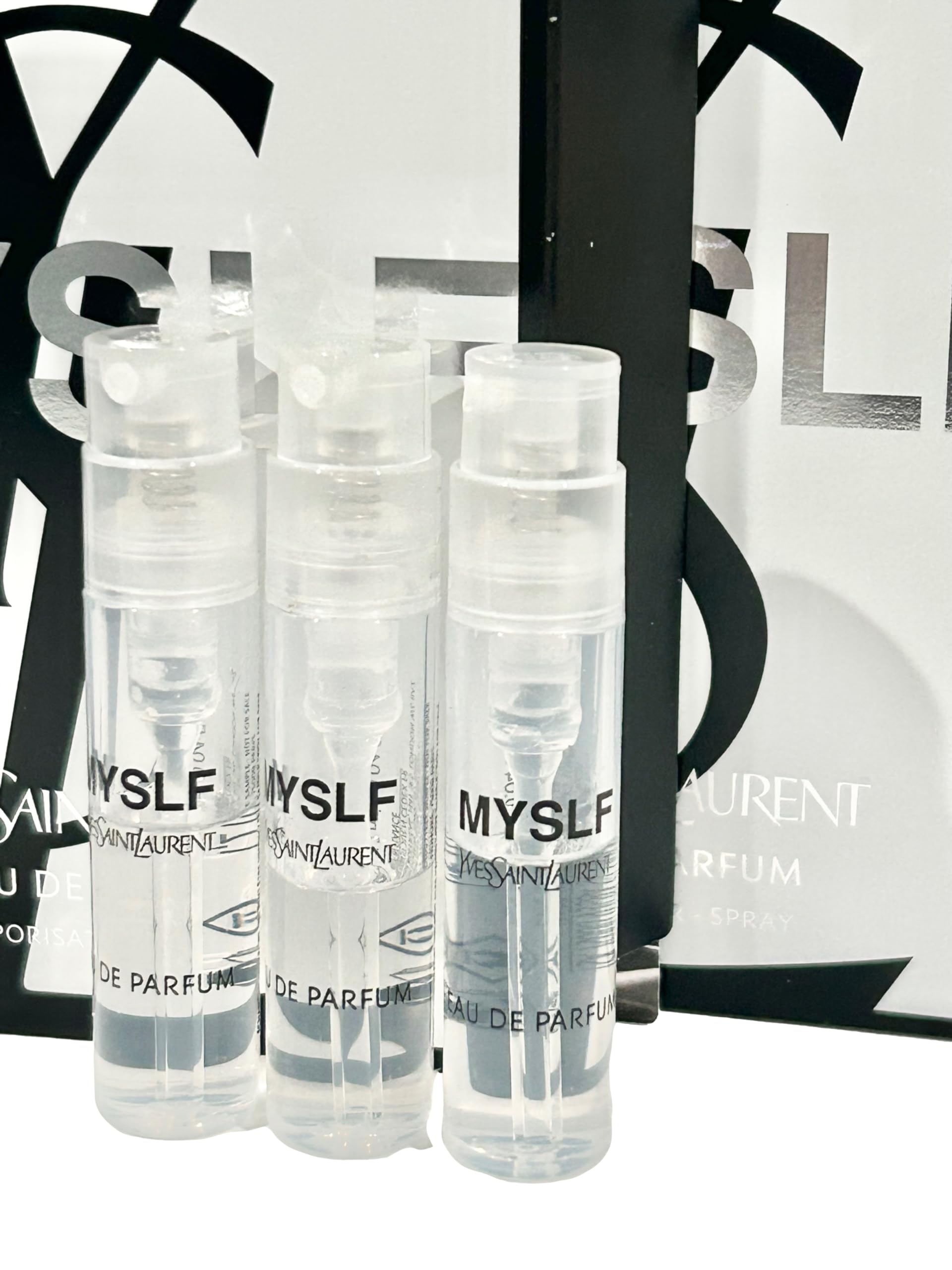 YSL MYSLF partially filled vials close-up showing portable on-the-go sample sizes.