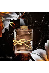 YSL Libre Flowers and Flames logo close-up with luxurious finish for premium fragrance.