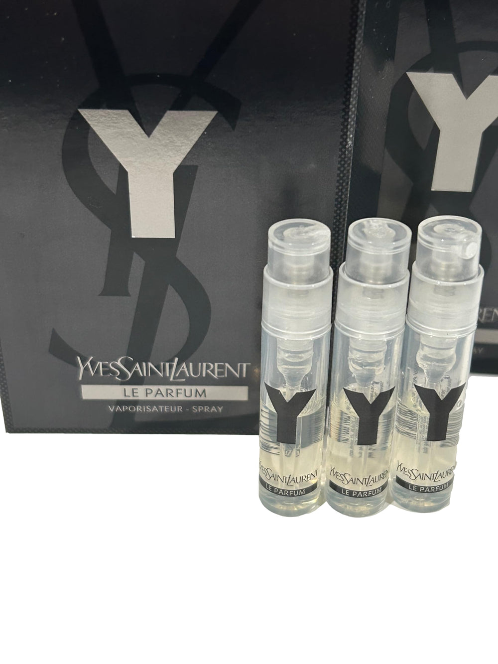 YSL Y Men travel-size spray bottle for on-the-go fragrance touch-ups.