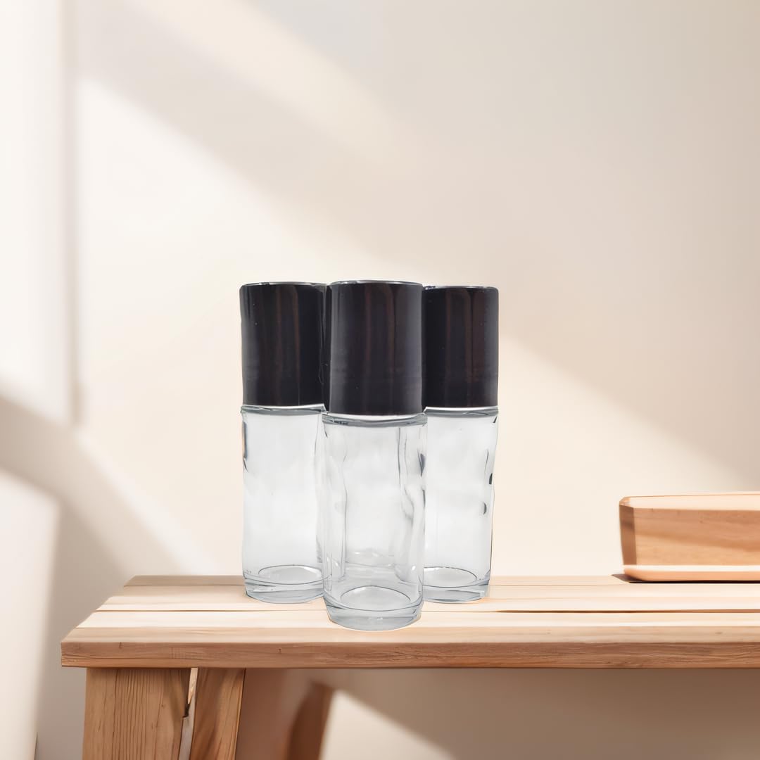 YYNGJCK roller bottle in use with essential oils and blends for personalized fragrance.