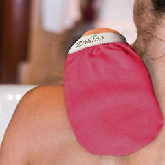 Zakia's Morocco Kessa glove pink fabric closeup highlights soft viscose texture for gentle scrubbing