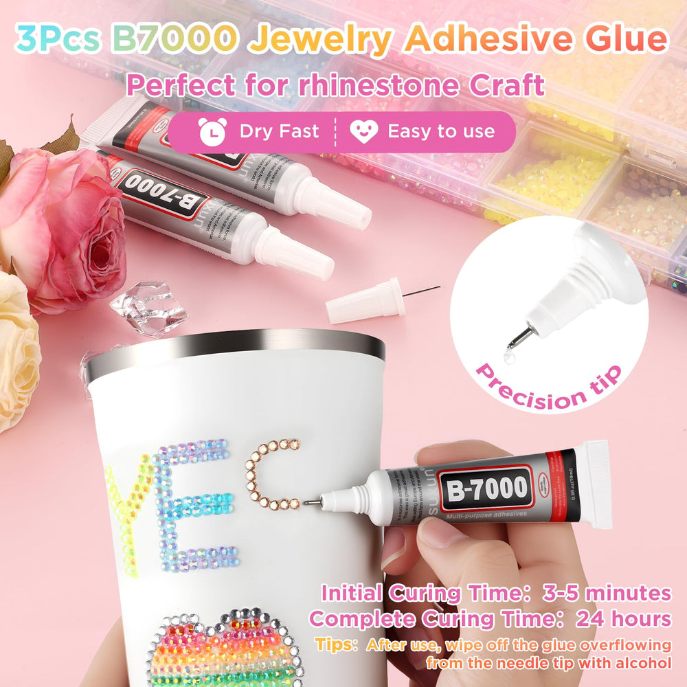 Zefy tweezers and pickup pen enable precise rhinestone placement.