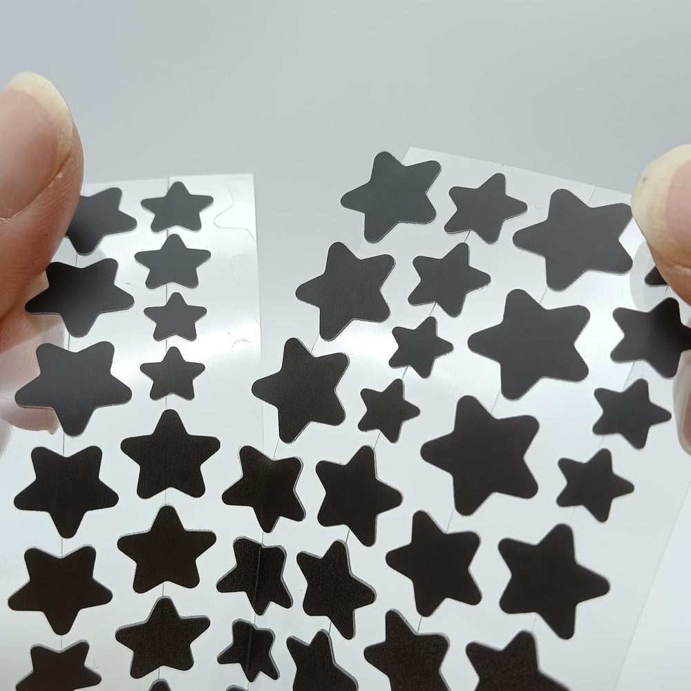 Close-up of a star-shaped ZHAOLIESM patch applied to the skin for adhesion.