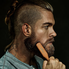 ZilberHaar 6-inch brush shown in hand for precise grooming.