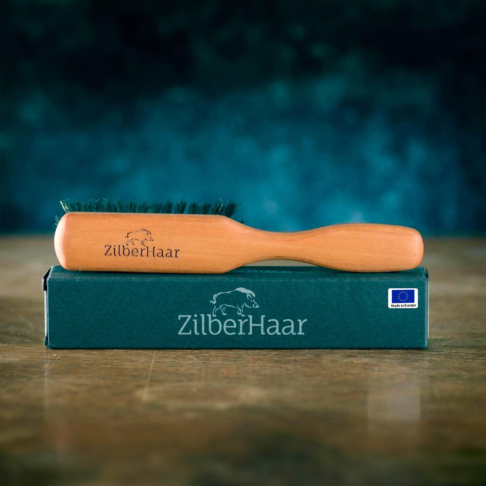 ZilberHaar beard brush with stiff boar bristles detangles and softens hair.
