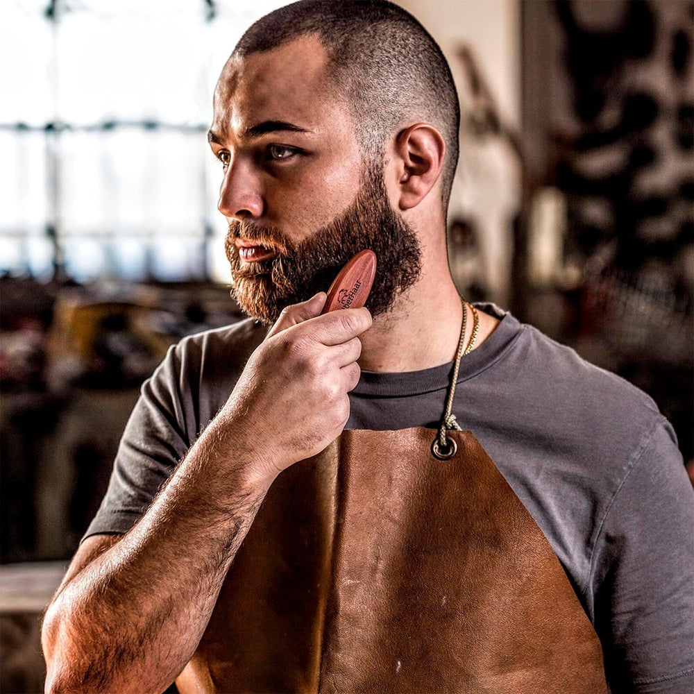 ZilberHaar travel-friendly beard brush in compact size, easy to stow in pockets or bags.