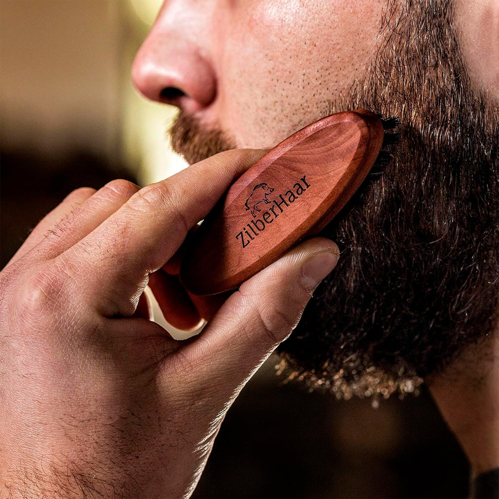 ZilberHaar travel grooming kit image shows compact beard brush for on-the-go care