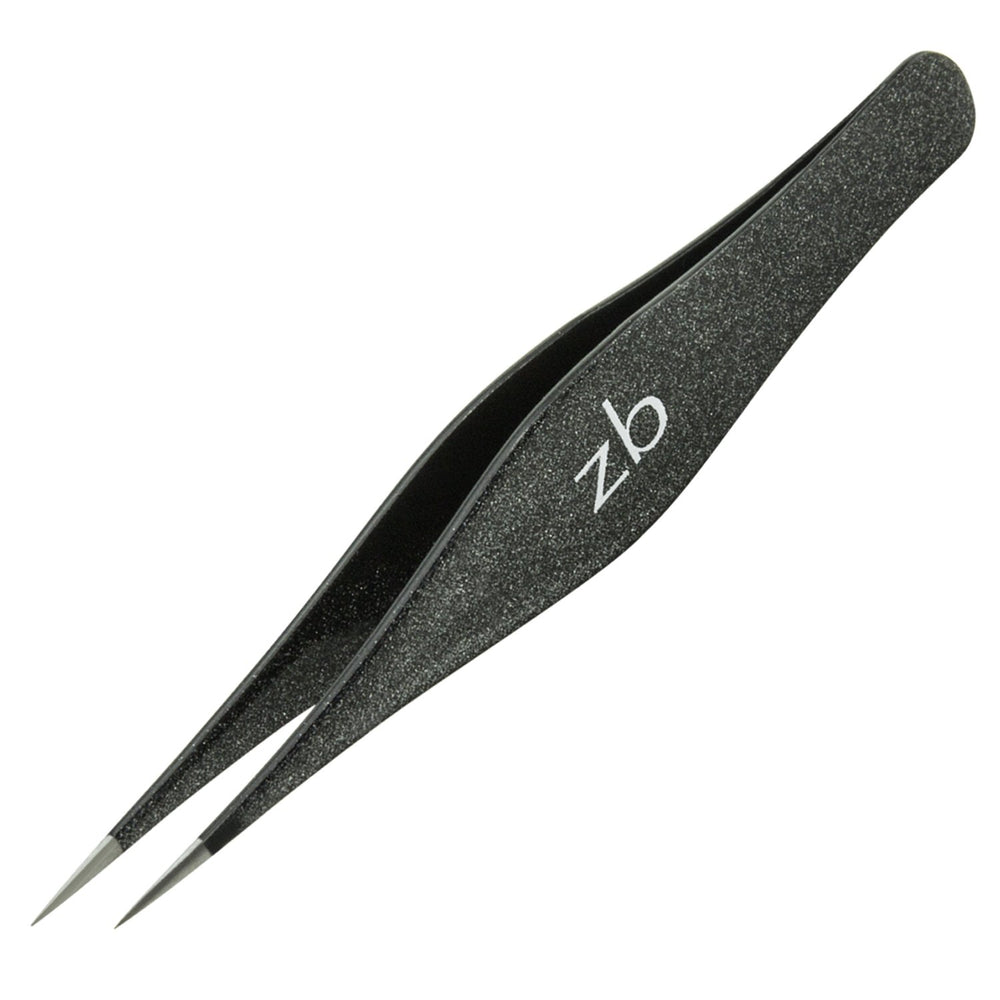 Zizzili Basics premium tweezers ready for travel and personal grooming routines.