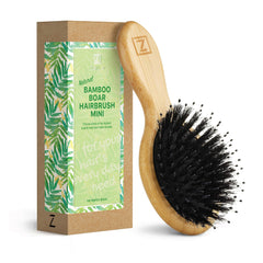 Zollo mini boar bristle brush close-up showing detangling and moisture distribution.