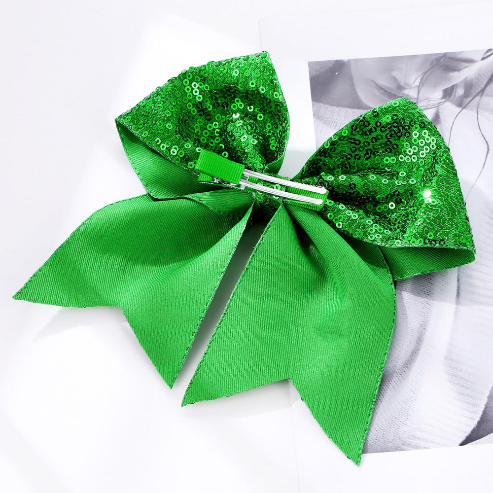 Zolyco green bow worn with bangs half-up styles for playful looks.