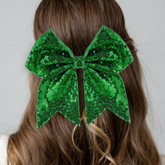 Zolyco green sequin bow close-up highlighting lightweight comfort and festive sparkle.