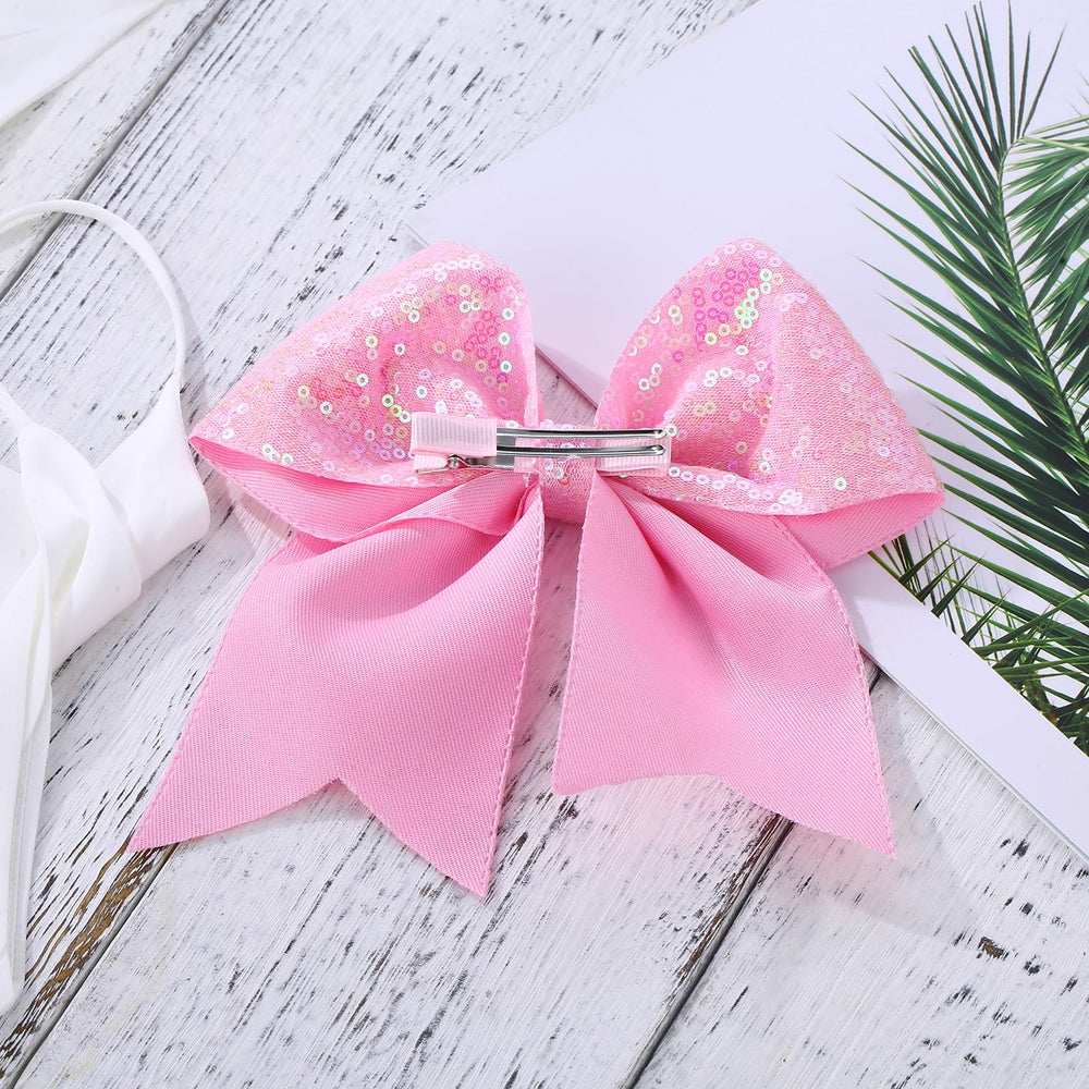 Zolyco pink bow on braid highlights subtle sparkle for everyday outfits