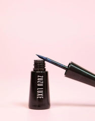 Zuzu Luxe Raven eyeliner applied to eyelid for a defined wing look.