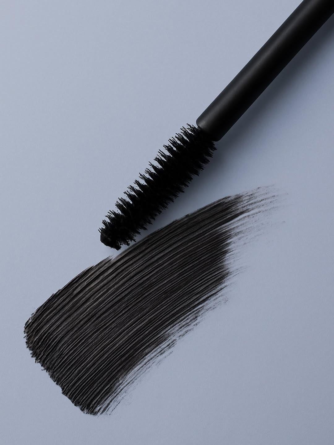 Zuzu Luxe Luxe Mascara Onyx wand in action adds length and curl