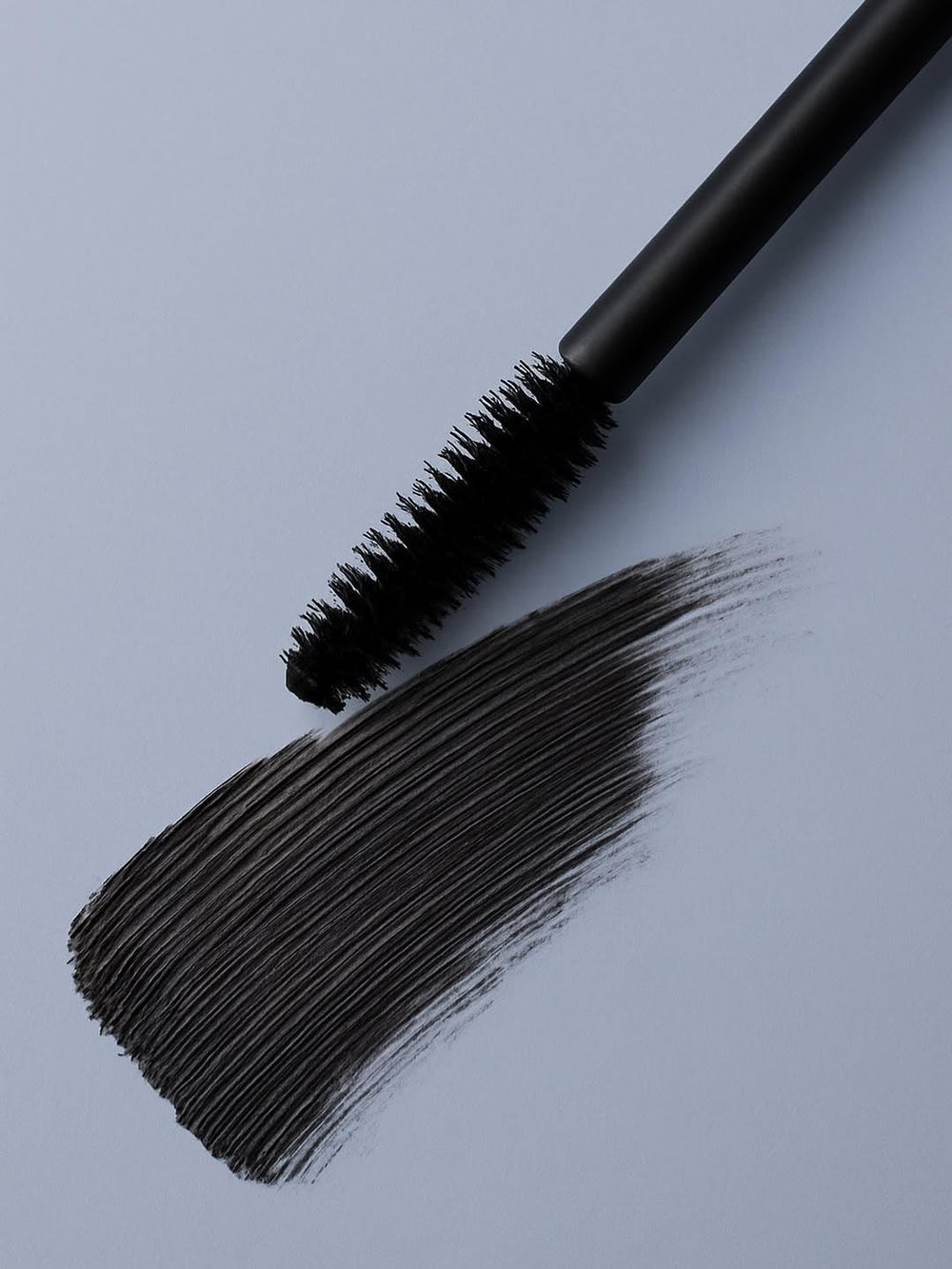 Zuzu Luxe Luxe Mascara Onyx wand in action adds length and curl